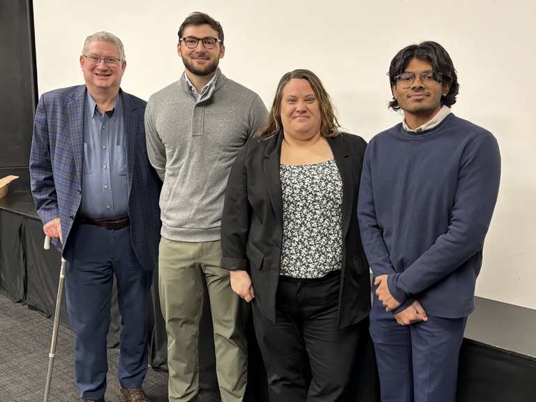 Labor center director Paul Iversen with Tech Law clinic professor Megan Graham and two students
